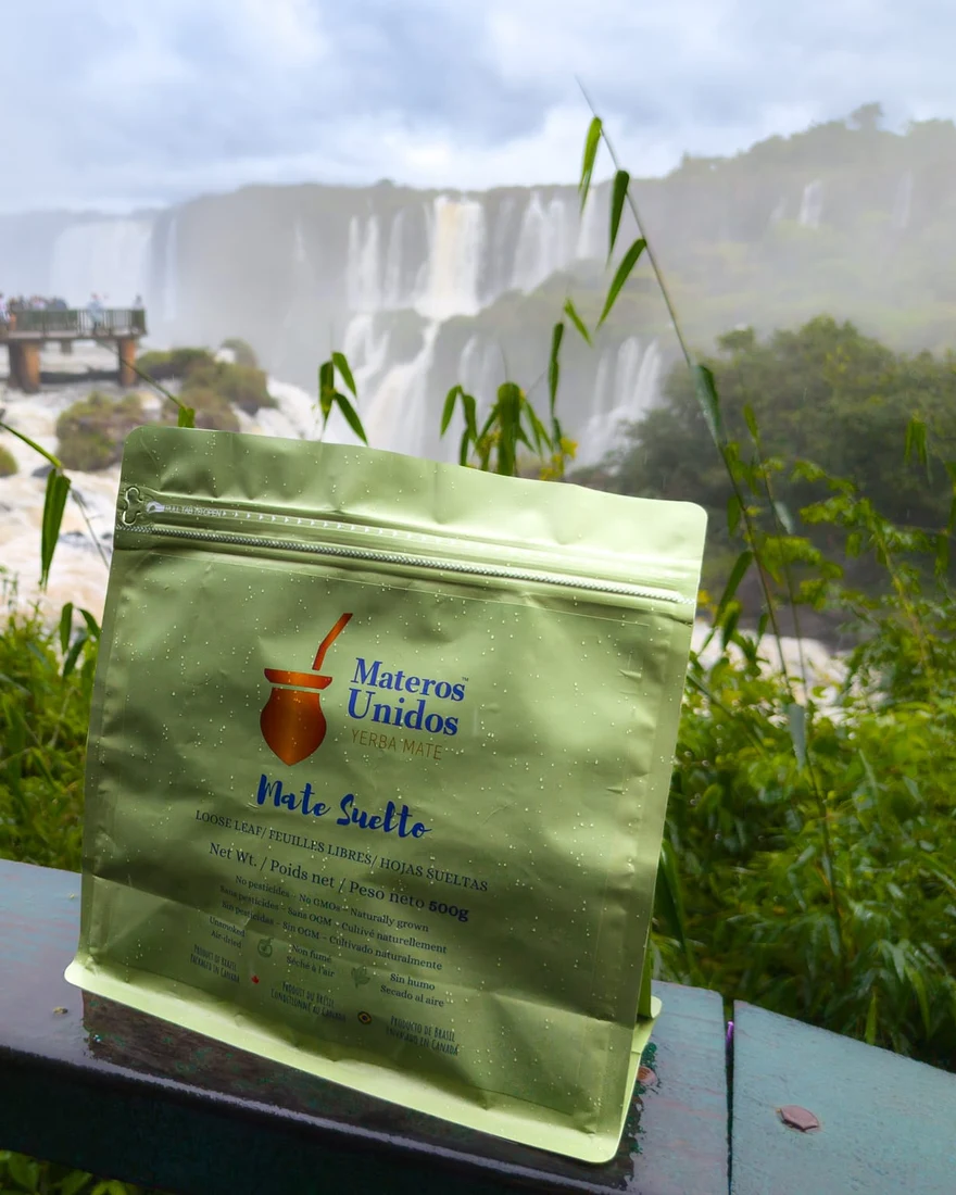 A bag of Materos Unidos Mate Suelto on a railing overlooking Iguazú Falls