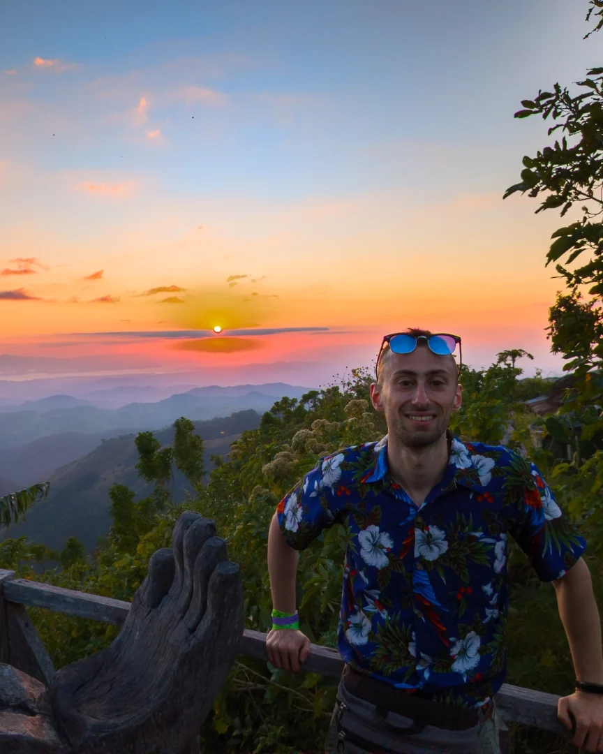 Nathan Marko Markarian standing on a mountain ridge in Monteverde, Costa Rica, at sunset